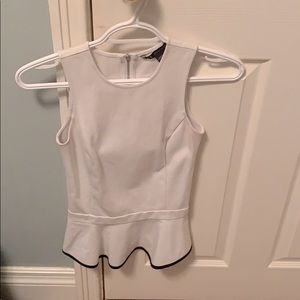 XS Armani Exchange white top.